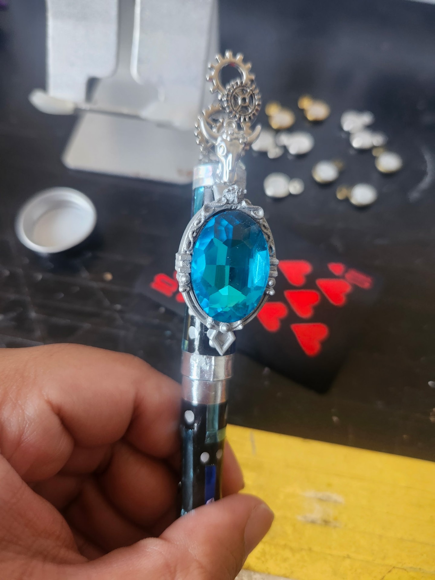 Hand-painted gem holder with steampunk gears topper, bright blue gem