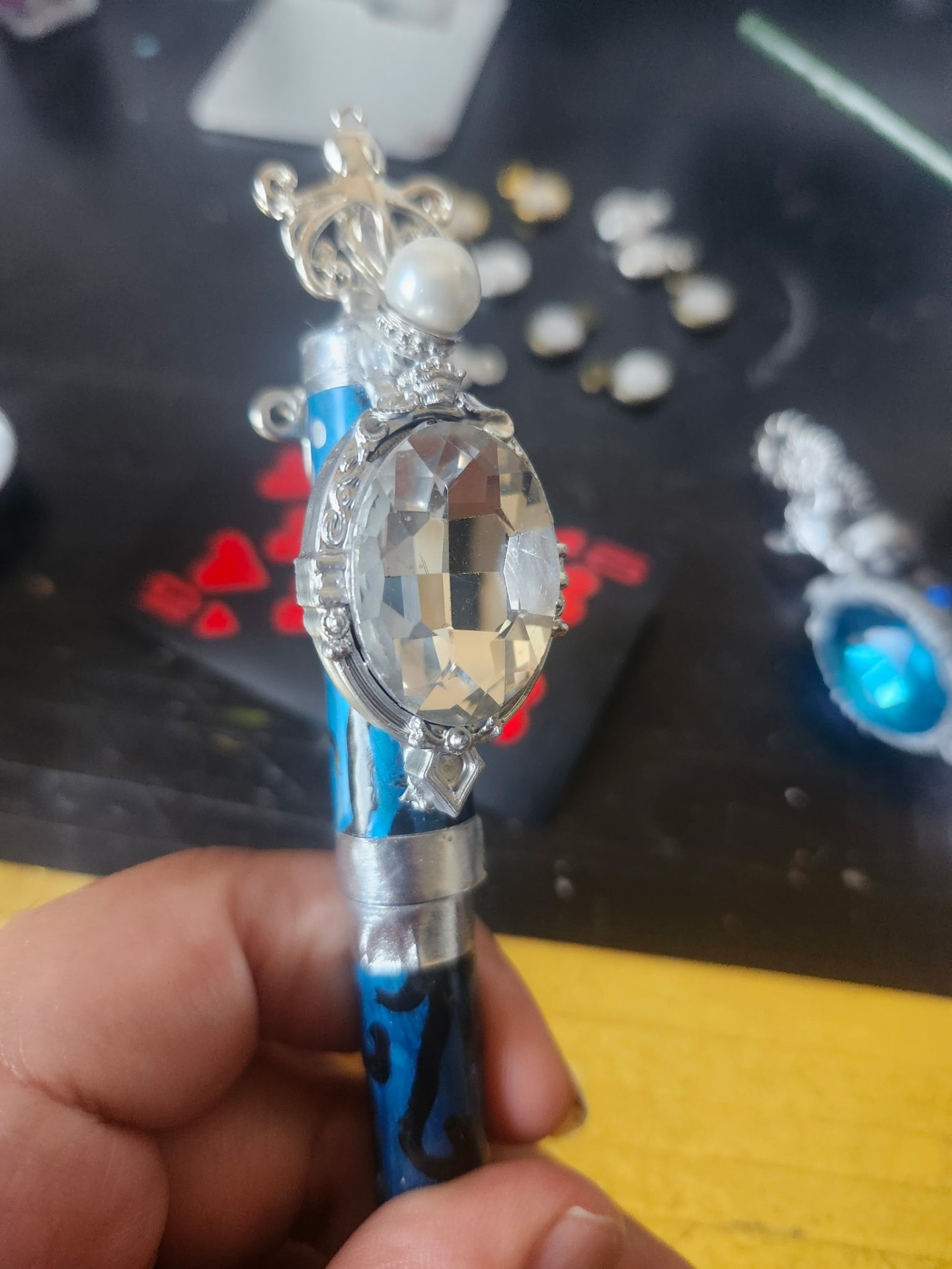Hand-painted gem holder with silver crown topper, clear gem