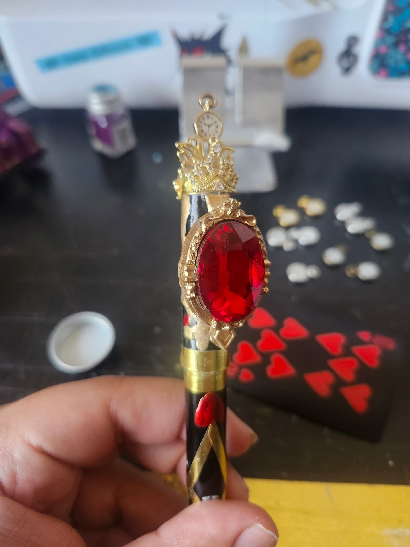 Hand-painted gem holder with crown-and-pocketwatch topper, ruby gem