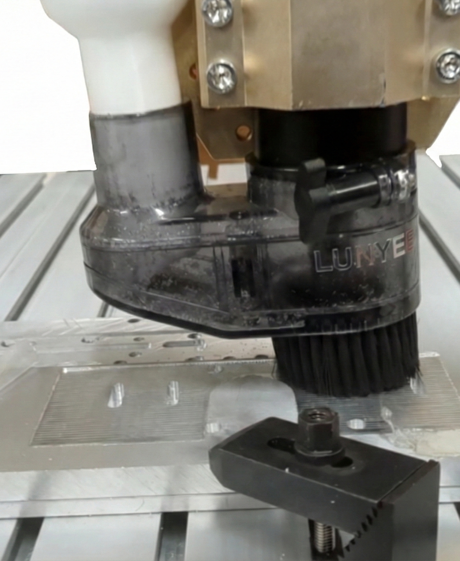 A CNC router machining an aluminum part.